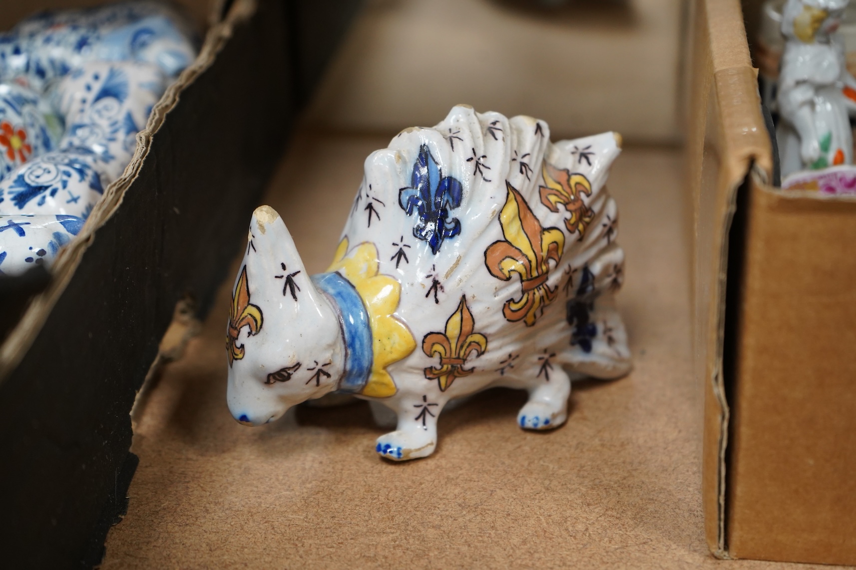 A collection of early 20th century French faience glazed animals, mostly cattle, largest 15cm